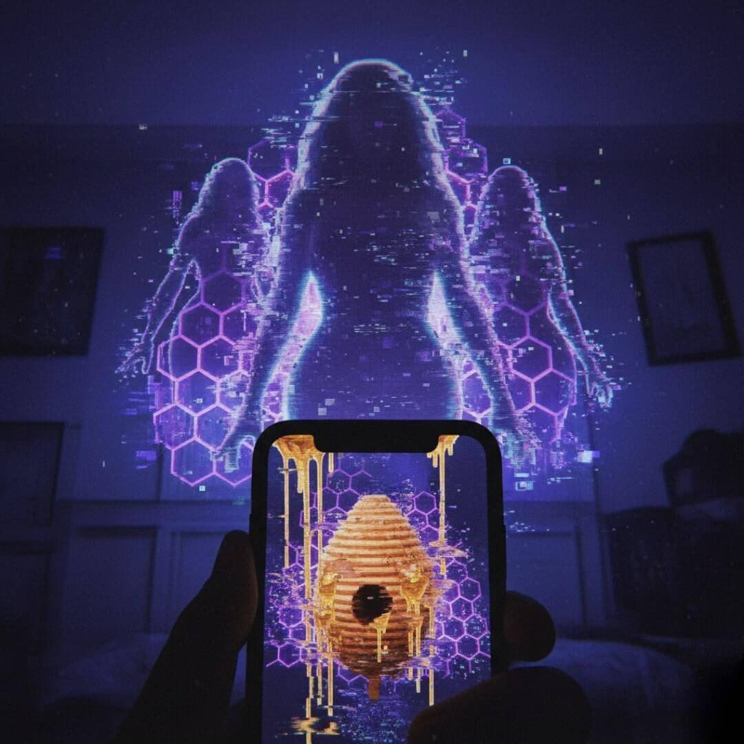 Alt Text: Personal-angle view of a phone screen displaying a digital beehive dripping honey, with a glitchy, purple-holographic silhouette of Beyoncé on the wall behind it.