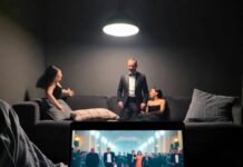 Top 10 Red Carpet Disasters You’ll Never Forget Blurry red carpet chaos spills from a laptop screen onto a rumpled couch, captured in low, tilted POV like a solo binge-watch mishap.